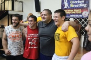 Barber, on right, next to Olympic Gold Medalist Rulon Gardner at a Chertow Camp